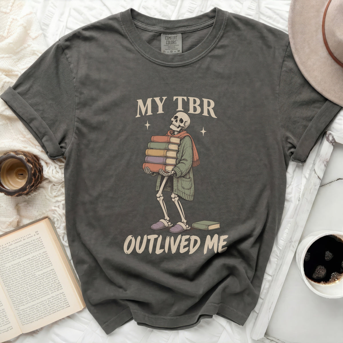 Skeleton carrying books with text "MY TBR OUTLIVED ME".