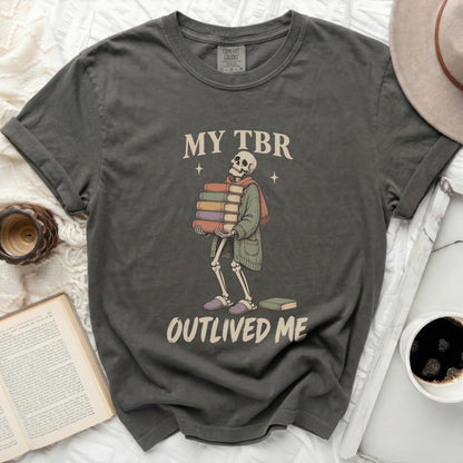 Skeleton carrying books with text "MY TBR OUTLIVED ME".