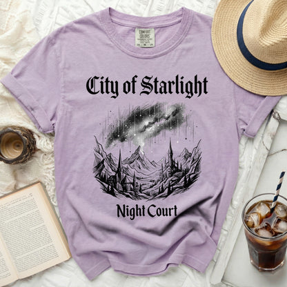 Purple t-shirt with "City of Starlight Night Court" text and celestial mountain graphic.