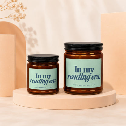 Two glass candles with black lids, each labeled "In my reading era."