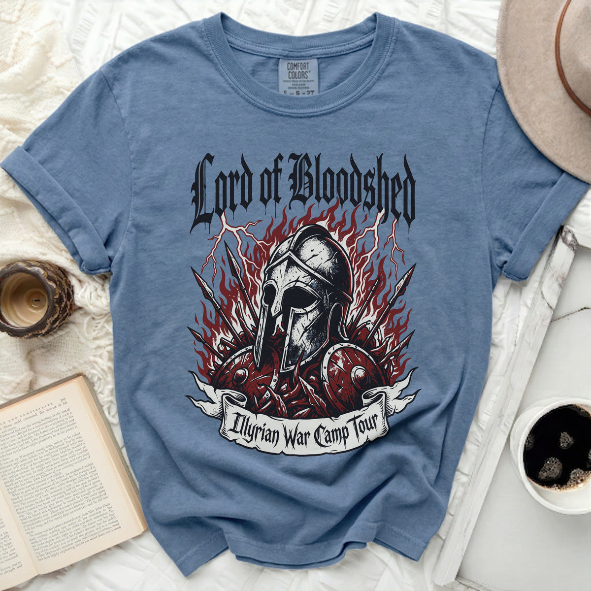 Blue t-shirt with "Lord of Bloodshed" and "Illyrian War Camp Tour" graphics.