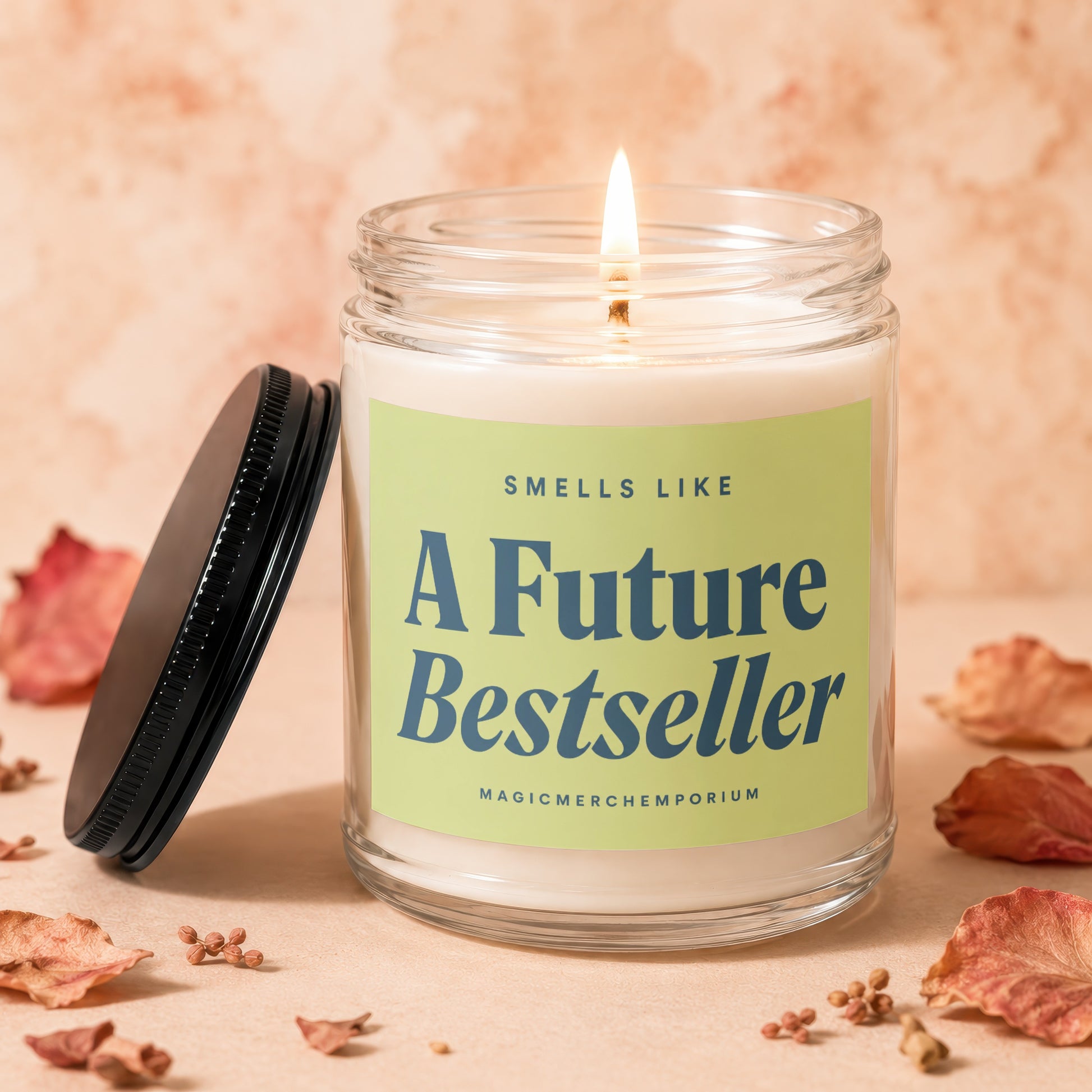 Lit candle in glass jar with "A Future Bestseller" label and black lid.