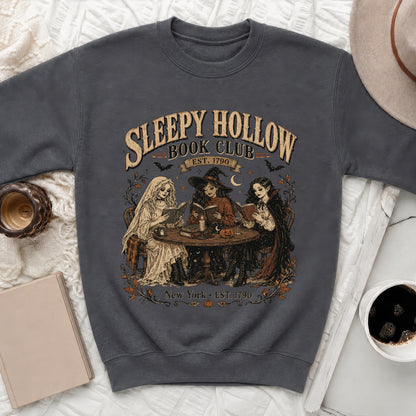 Sleepy Hollow Book Club graphic with three figures reading on a sweatshirt.