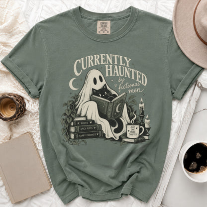 Green t-shirt with ghost, black cat, and books graphic: "Currently Haunted by Fictional Men."