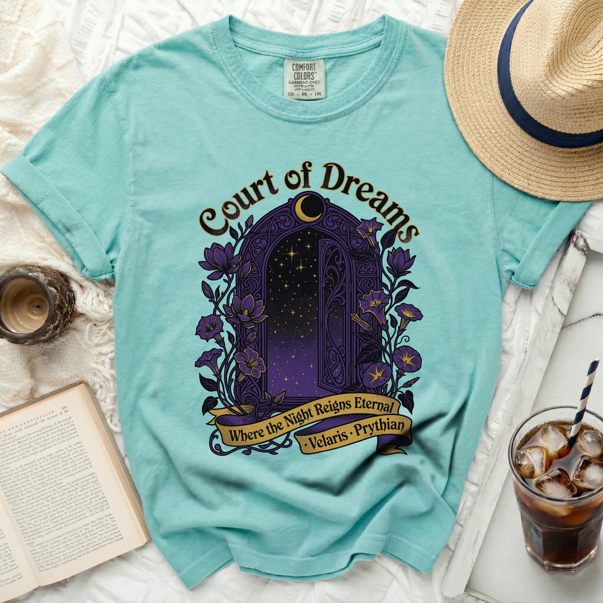 Teal t-shirt with a purple arched doorway design featuring stars and flowers.