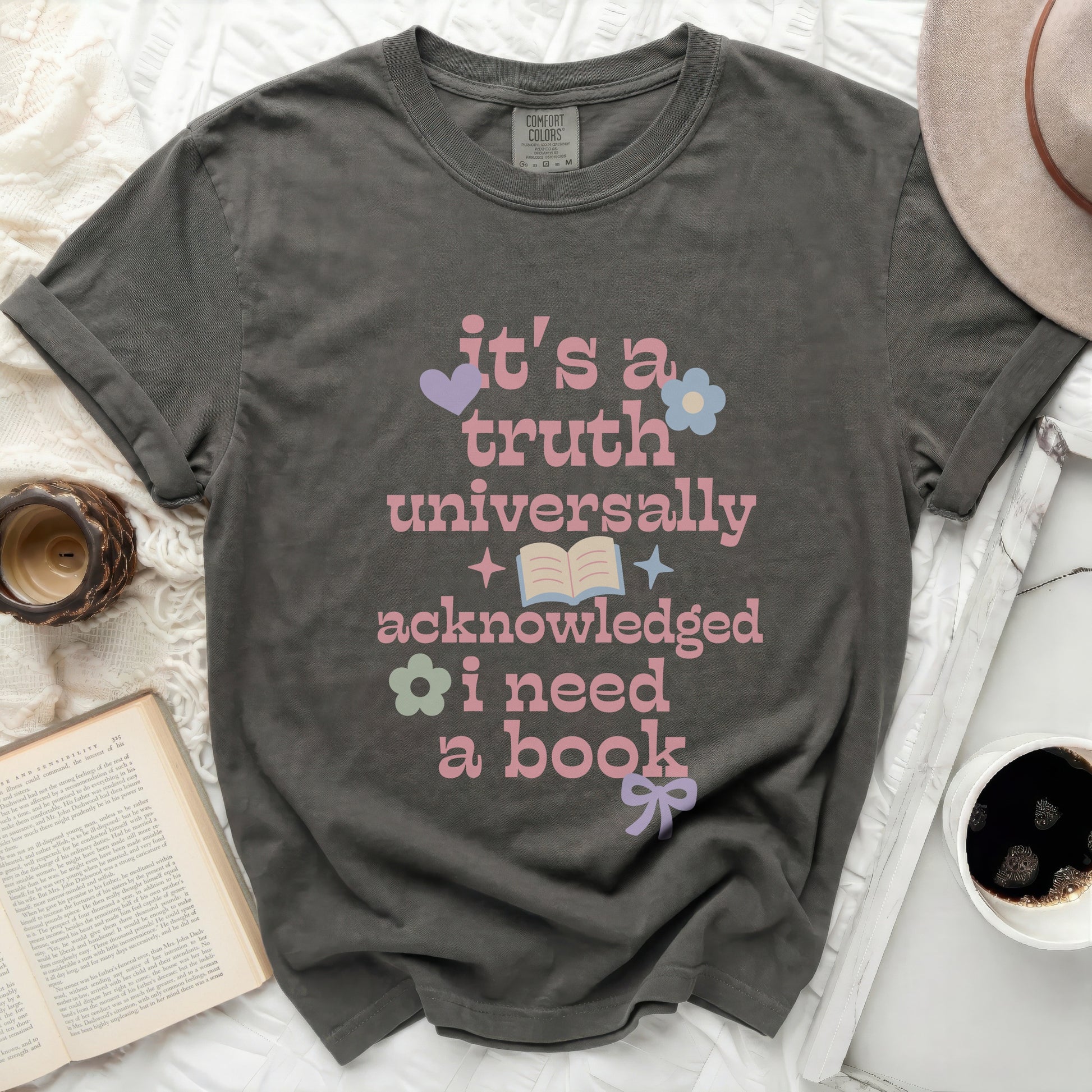 Comfort Colors shirt with text "It's a truth universally acknowledged I need a book".