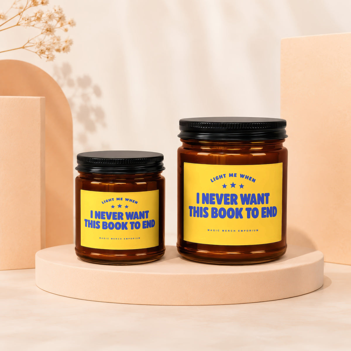 Two candles with yellow labels reading "I NEVER WANT THIS BOOK TO END".