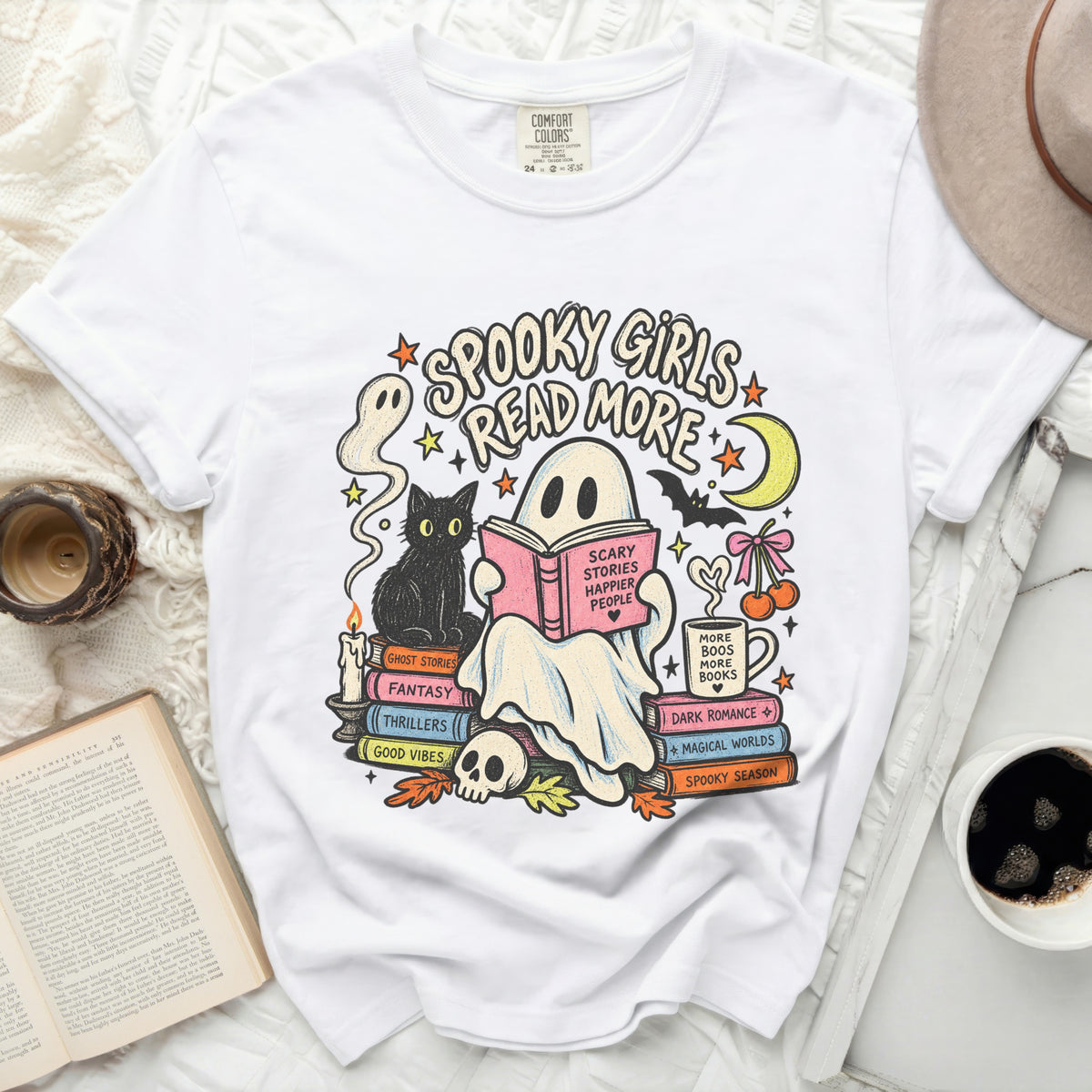 White t-shirt with "Spooky Girls Read More" graphic featuring ghosts, books, and a cat.