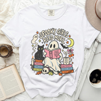 White t-shirt with "Spooky Girls Read More" graphic featuring ghosts, books, and a cat.