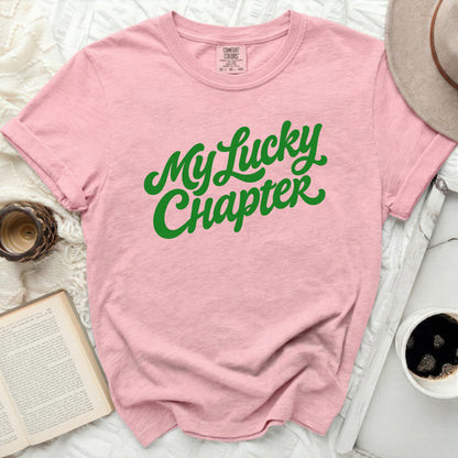 Pink t-shirt with green text that reads "My Lucky Chapter".