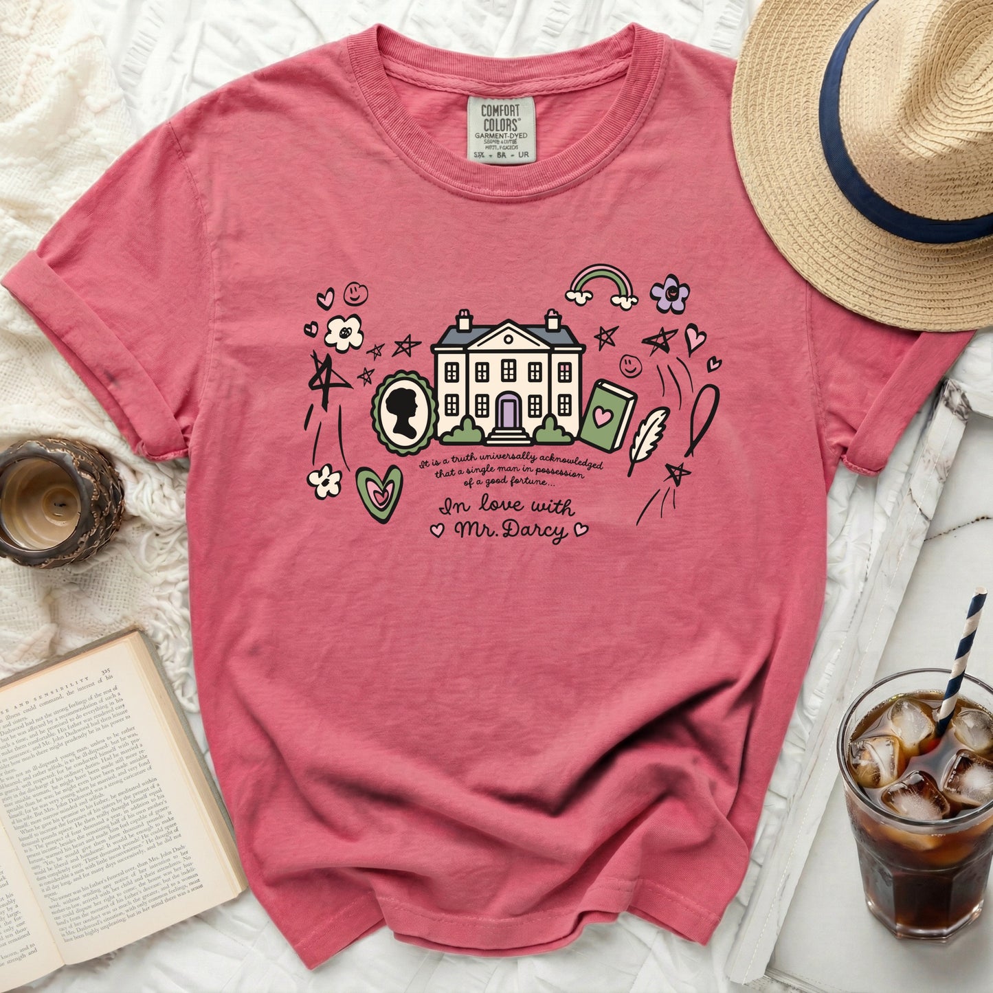 Pink t-shirt with Pride and Prejudice quote and house graphic.