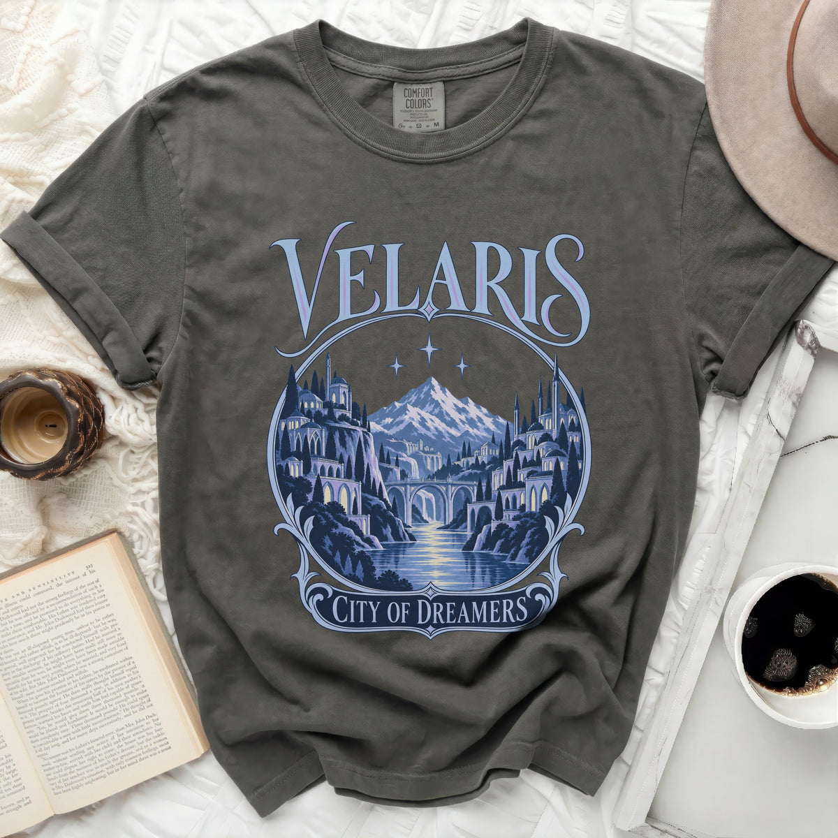 Velaris City of Dreamers graphic tee with mountain and cityscape design.