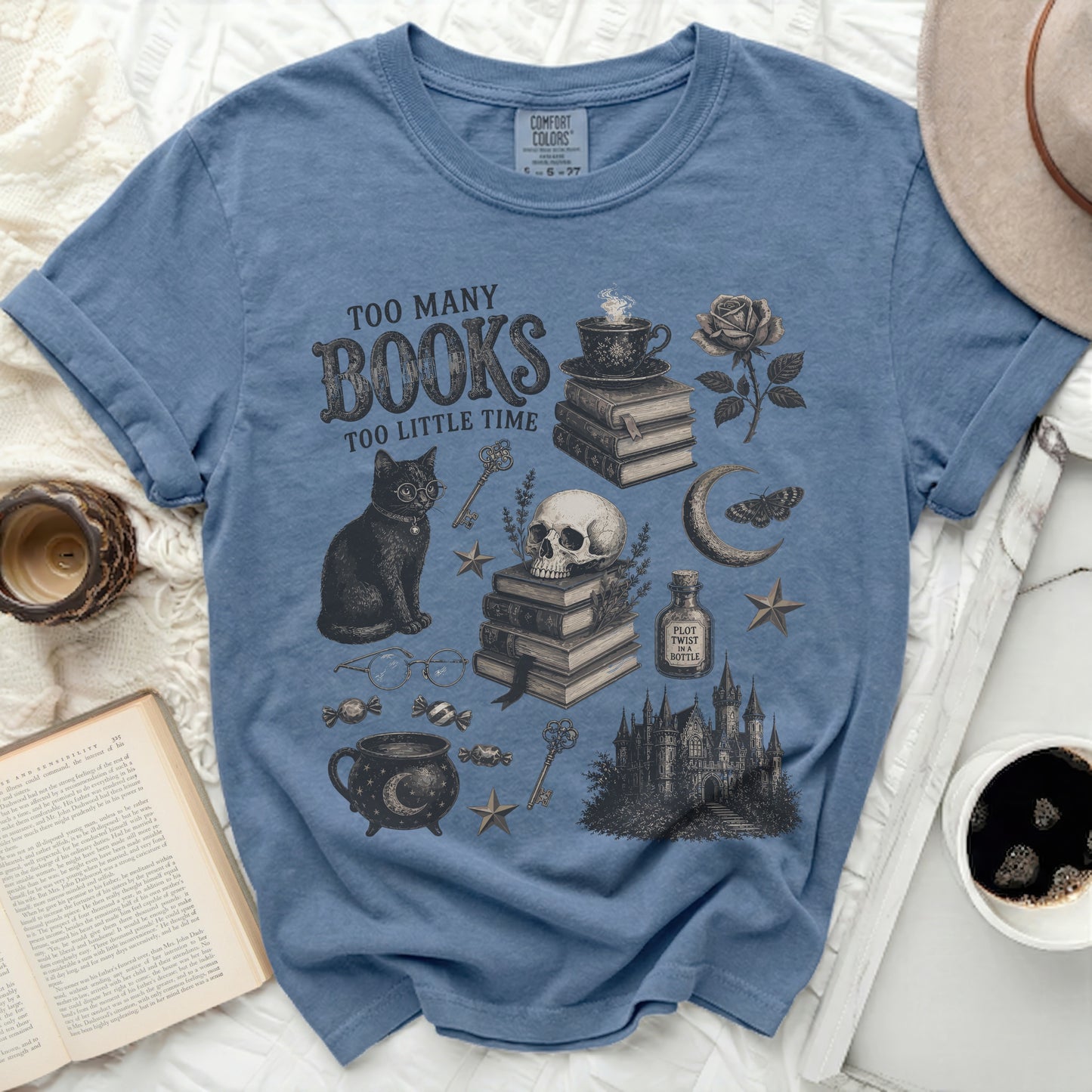 "Too Many Books Too Little Time" with illustrations of a black cat, books, skull, and castle.