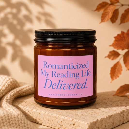 Amber jar candle with pink label reading 'Romanticized My Reading Life. Delivered.'
