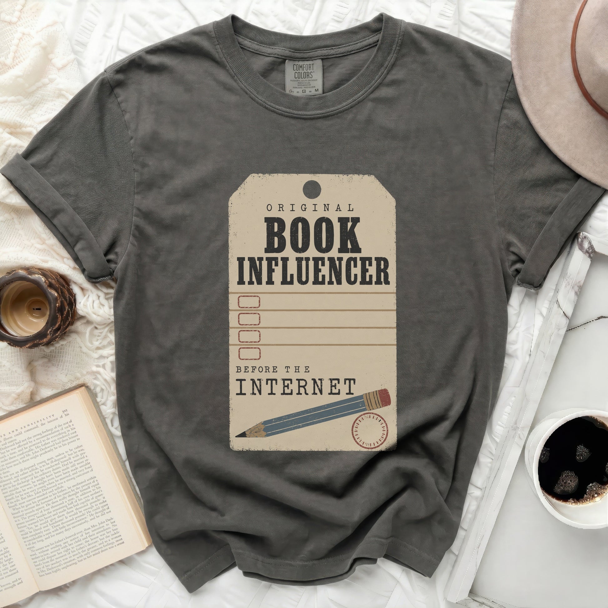 Dark gray t-shirt with "Original Book Influencer Before The Internet" graphic.