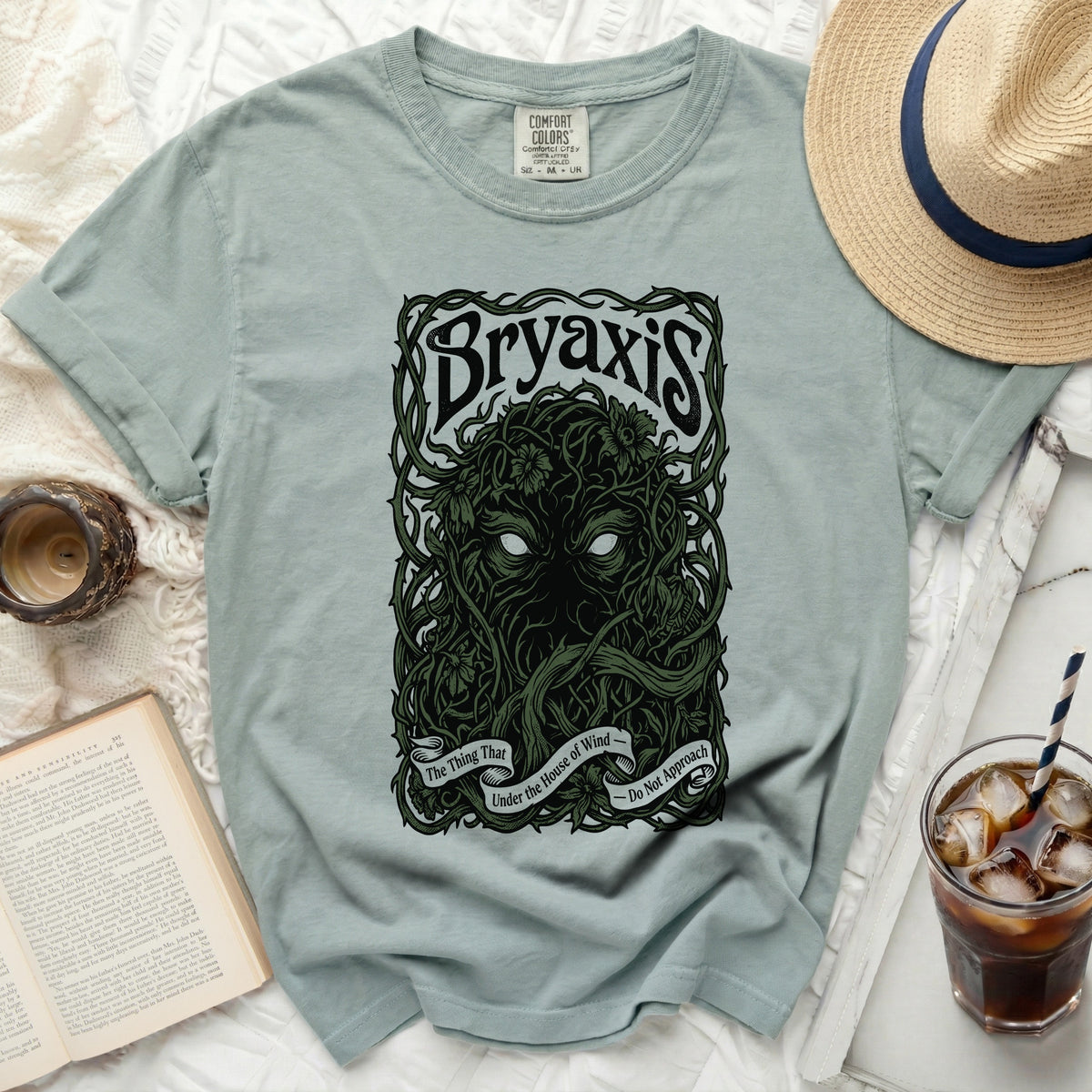 Bryaxis t-shirt with a dark green thorny vine design and text.