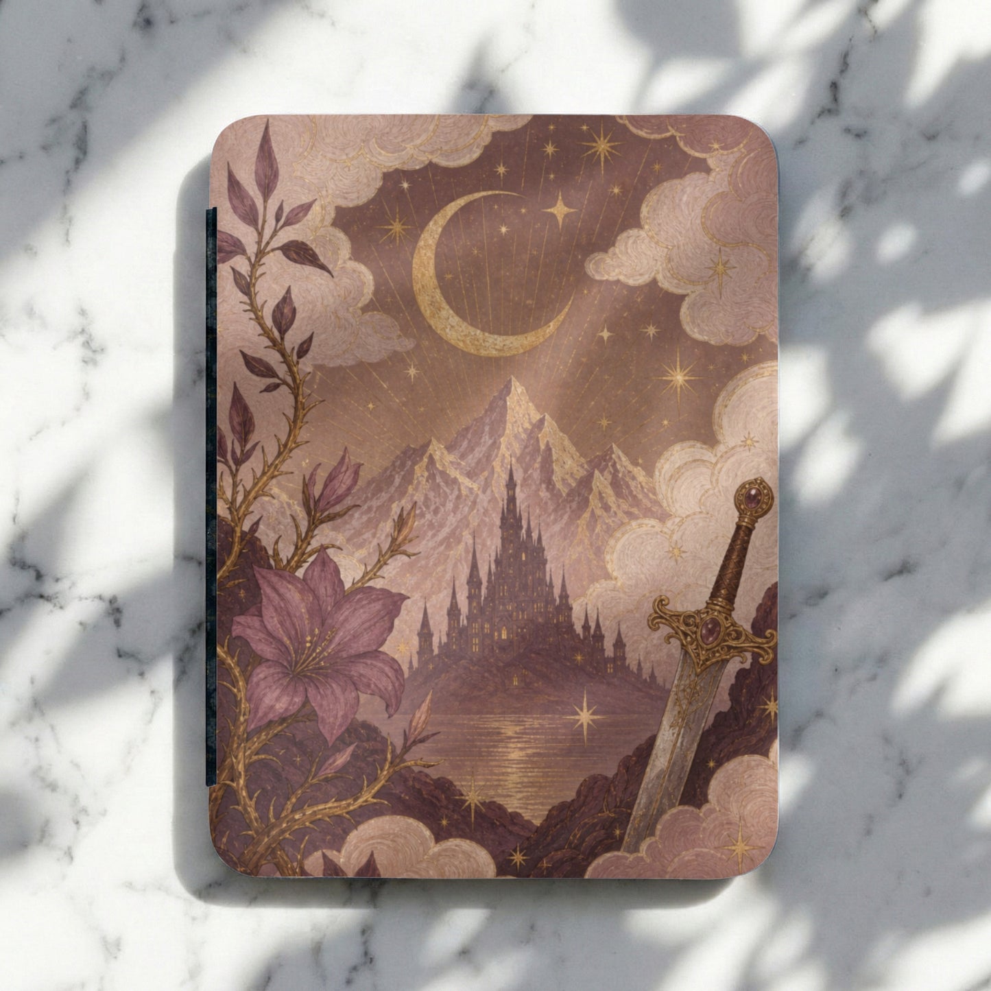 Fantasy castle with moon, stars, flower, and ornate sword on a marble surface.