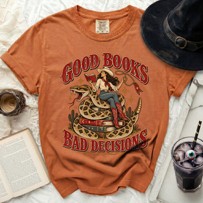 T-shirt graphic with woman on snake reading "Good Books, Bad Decisions."