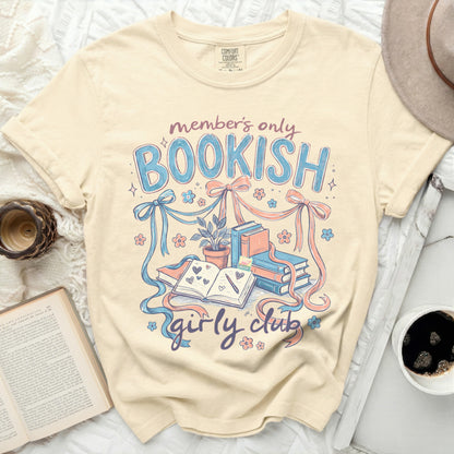 T-shirt with "member's only bookish girly club" text and book illustrations.