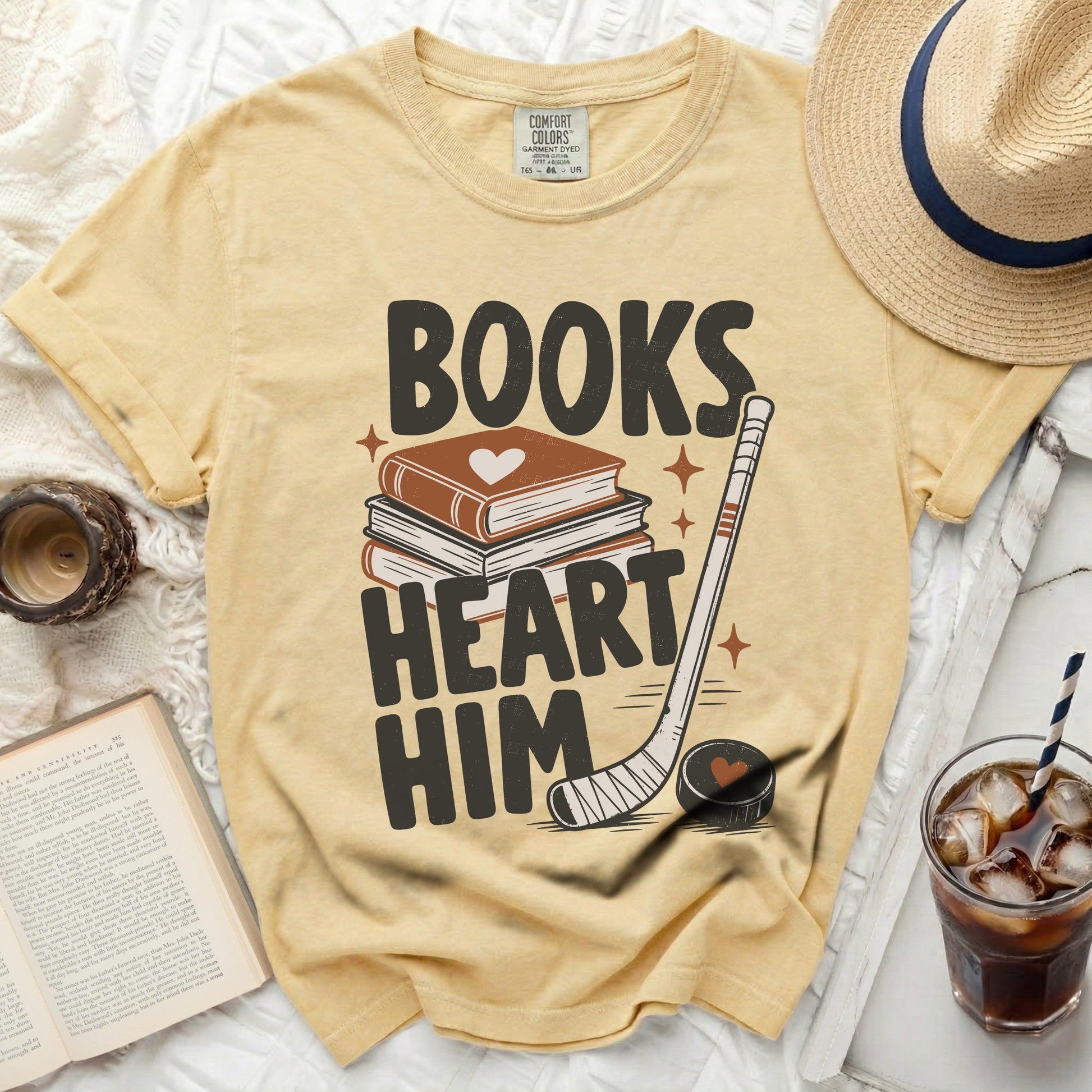 Yellow t-shirt with "Books Heart Him" and hockey graphic.