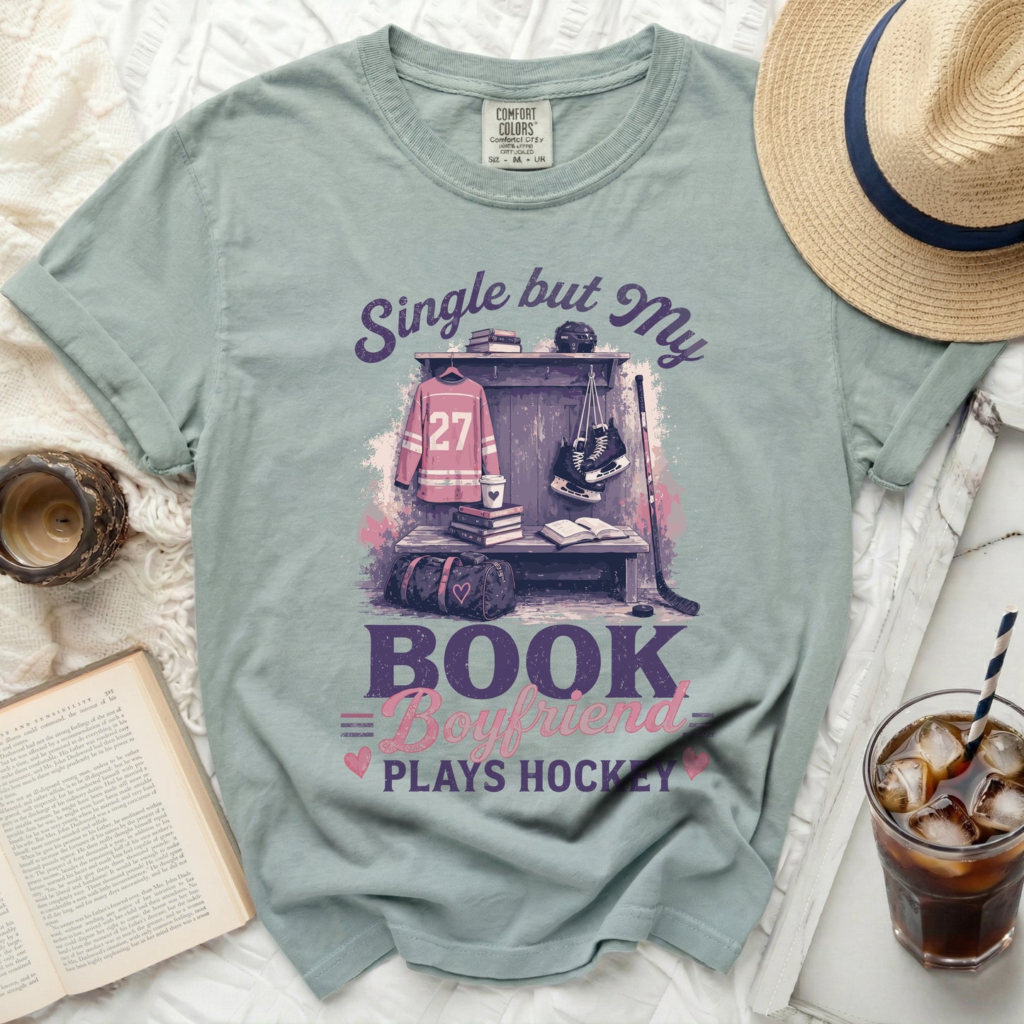 T-shirt with "Single but My Bookworm Plays Hockey" text and hockey gear.