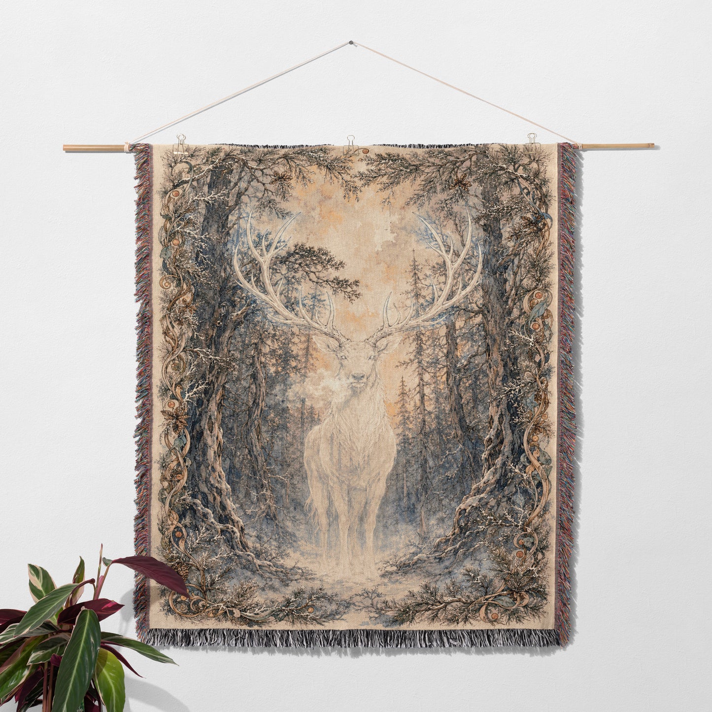 a tapestry hanging on a wall, depicting a deer standing in a forest setting.