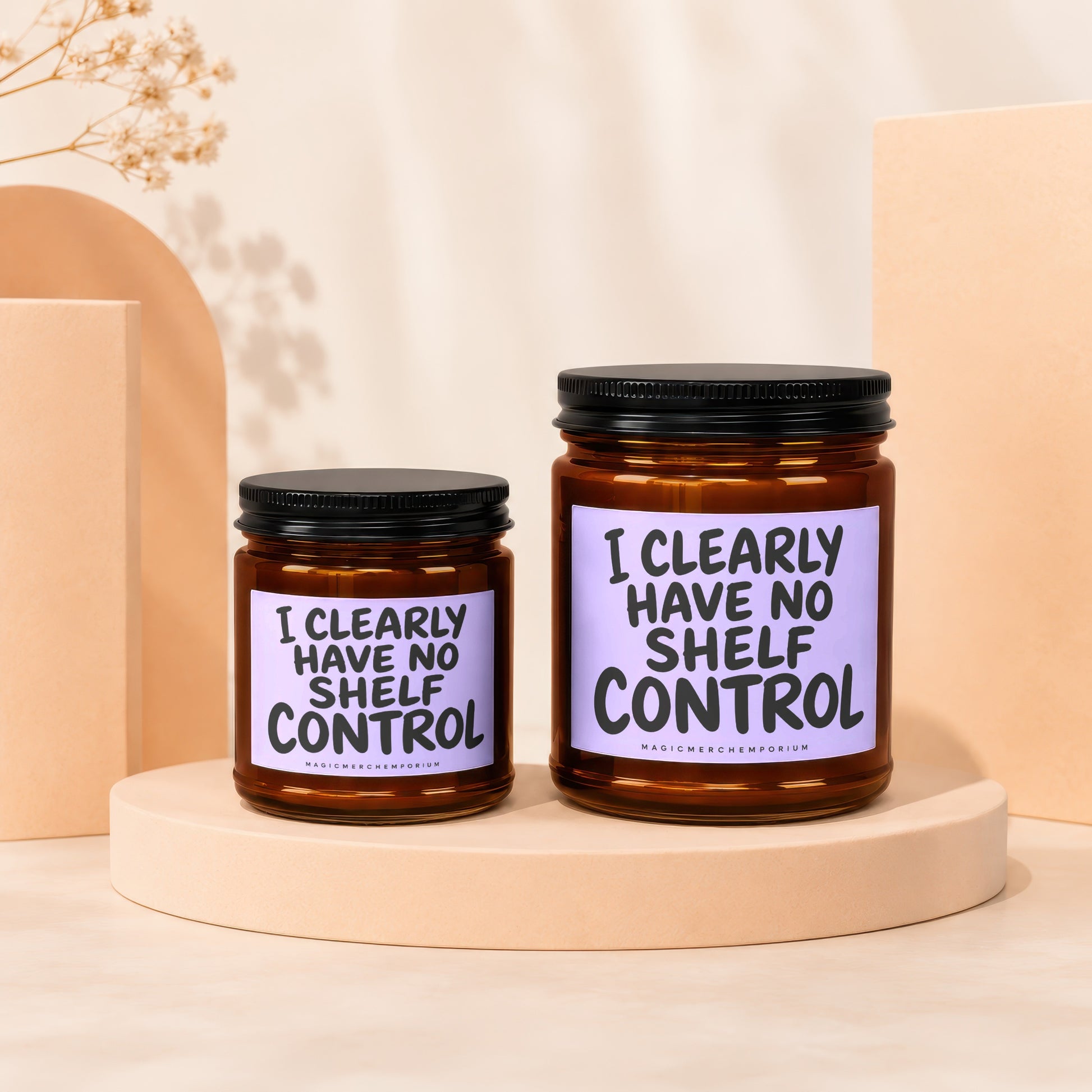 Two glass jars with black lids on display stands, featuring text.