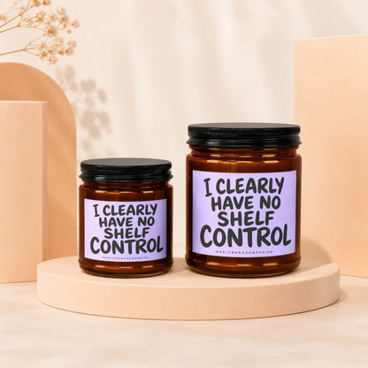Two glass jars with black lids on display stands, featuring text.