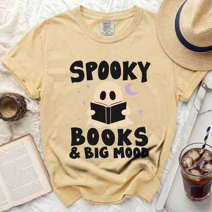 Yellow t-shirt with "Spooky Books & Big Mood" Halloween graphic.