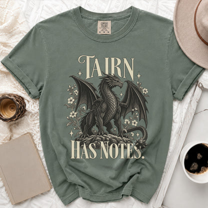 Green t-shirt with a black dragon design and text "TAIRN HAS NOTES."