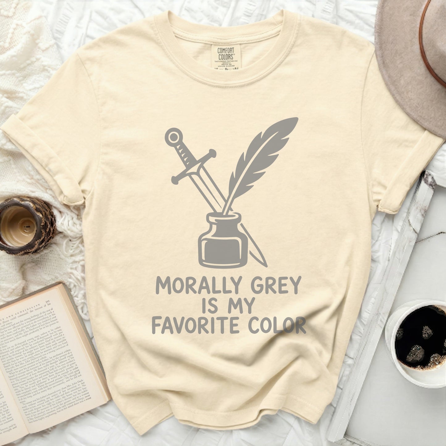 Cream t-shirt with sword, quill, and "Morally Grey is My Favorite Color" text.
