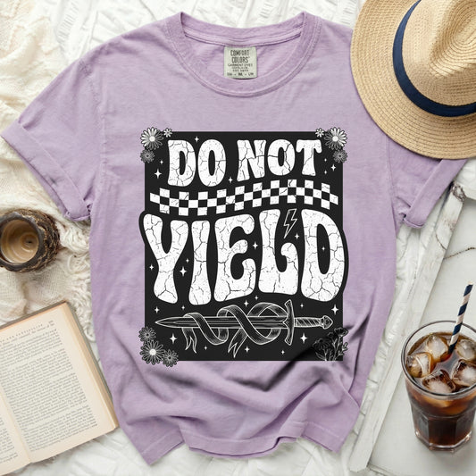 Purple t-shirt with "DO NOT YIELD" graphic and sword.