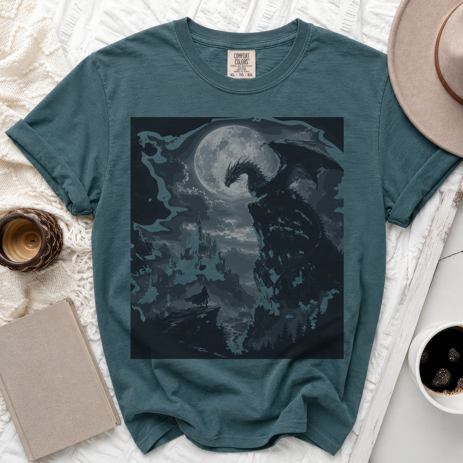 Teal t-shirt with a dark fantasy dragon perched on a cliff under a full moon.