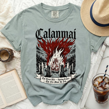 Green t-shirt with "Calanmai" and bonfire illustration, "The Great Rite - Spring Court - The Fire Must Be Fed".