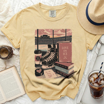 Yellow t-shirt with hockey and book graphics and text.