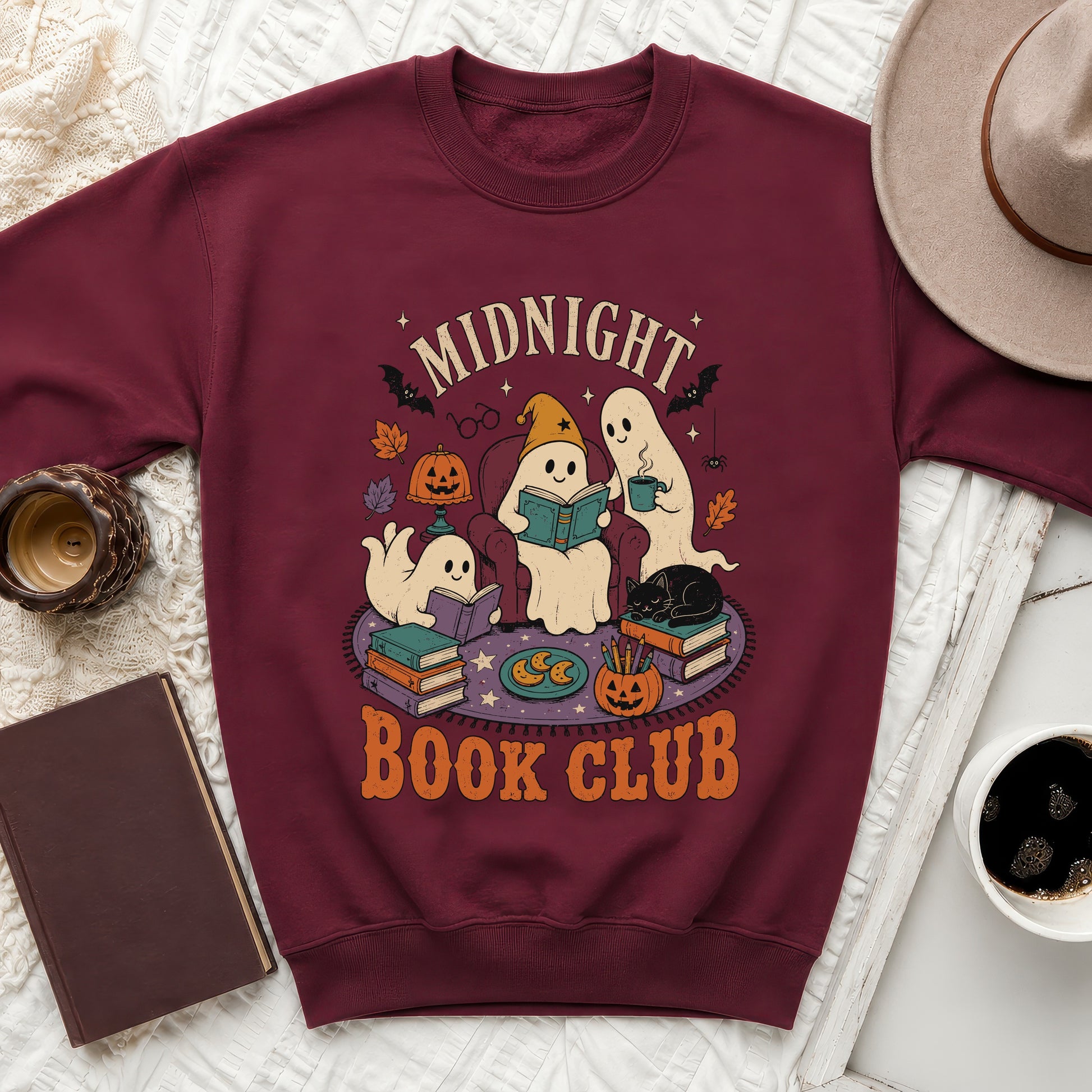 Maroon sweatshirt with "Midnight Book Club" graphic featuring ghosts and Halloween elements.