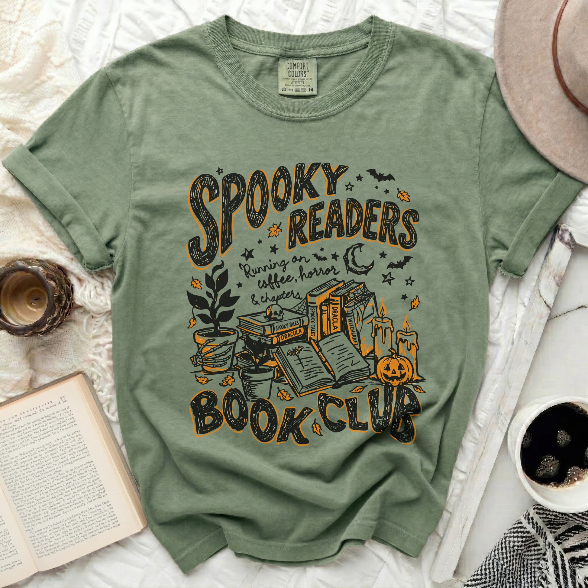 Green shirt with "Spooky Readers Book Club" Halloween-themed graphic.