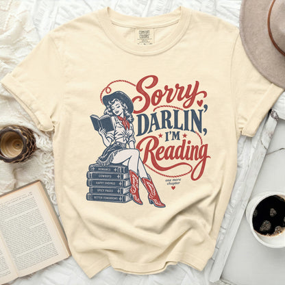 Cowgirl reading books with text "Sorry Darlin, I'm Reading."