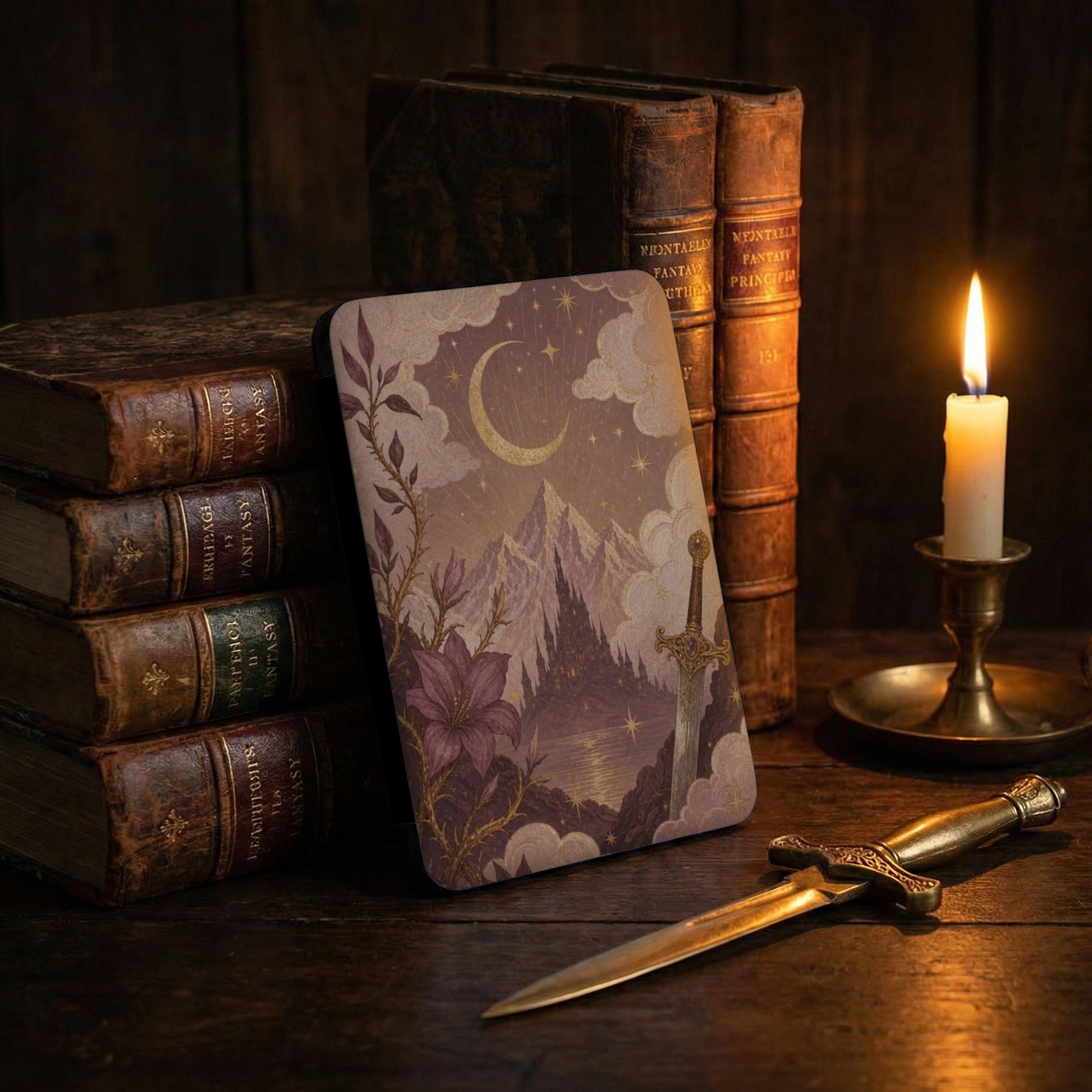 Book with fantasy cover art, sword, and lit candle on a wooden table.