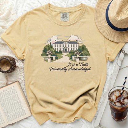 Yellow comfort colors t-shirt with illustration of a mansion and text "It is a Truth Universally Acknowledged".