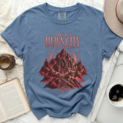 Hewn City Court of Nightmares t-shirt with a castle on a mountain graphic.