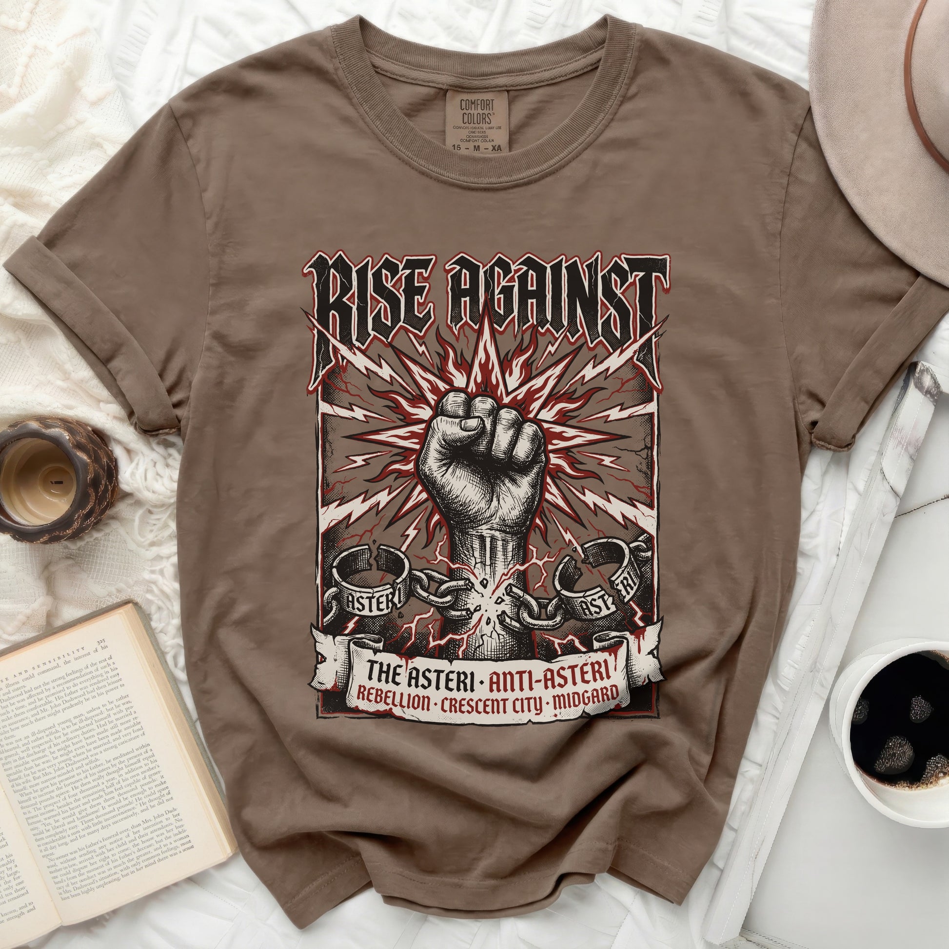 Brown t-shirt with a Rise Against fist graphic and band text.