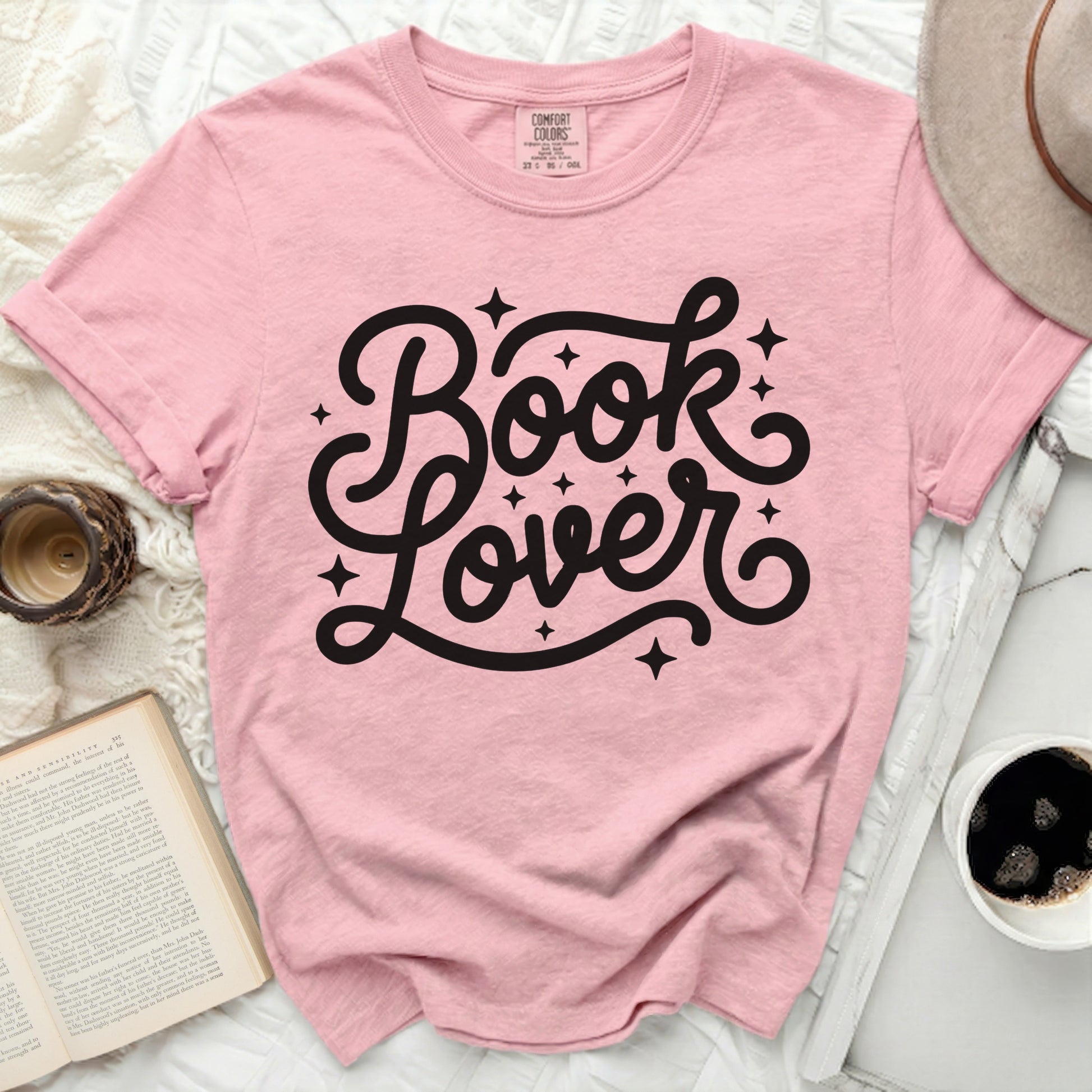 Pink t-shirt with "Book Lover" text and stars.