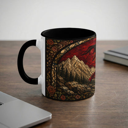Mug with stained glass design of a dragon over a rocky mountain landscape and roses.