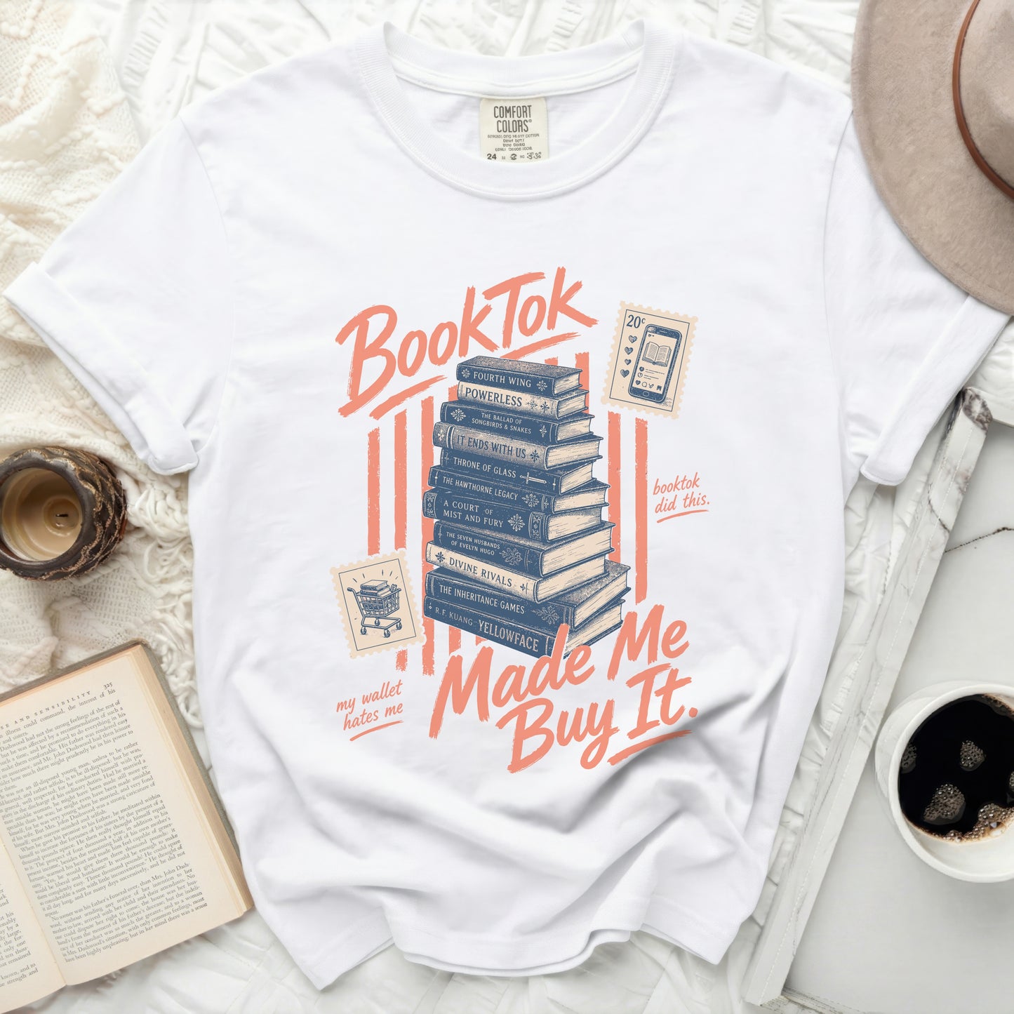White t-shirt with "BookTok made me buy it" and stacked books graphic.