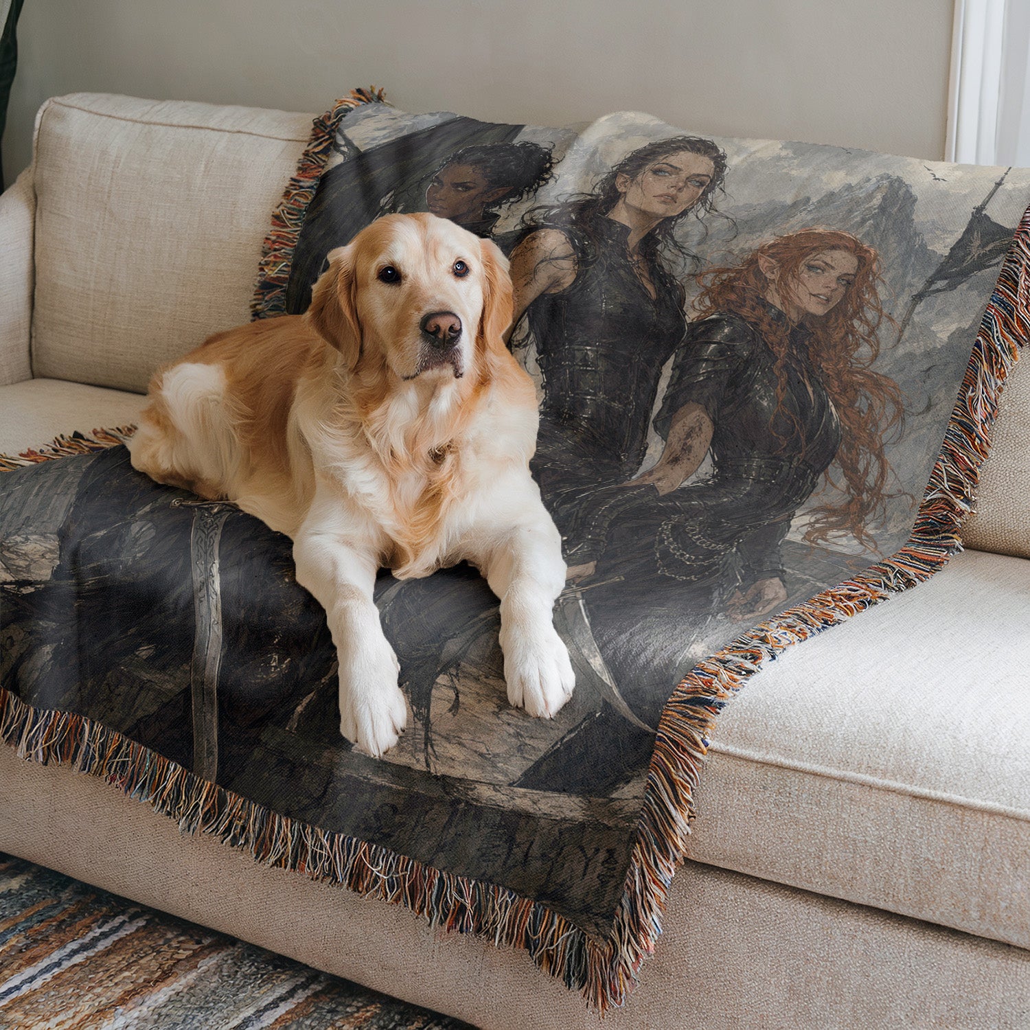 A golden retriever dog is sitting on a couch, with a black and white patterned blanket featuring images of two women in the background.