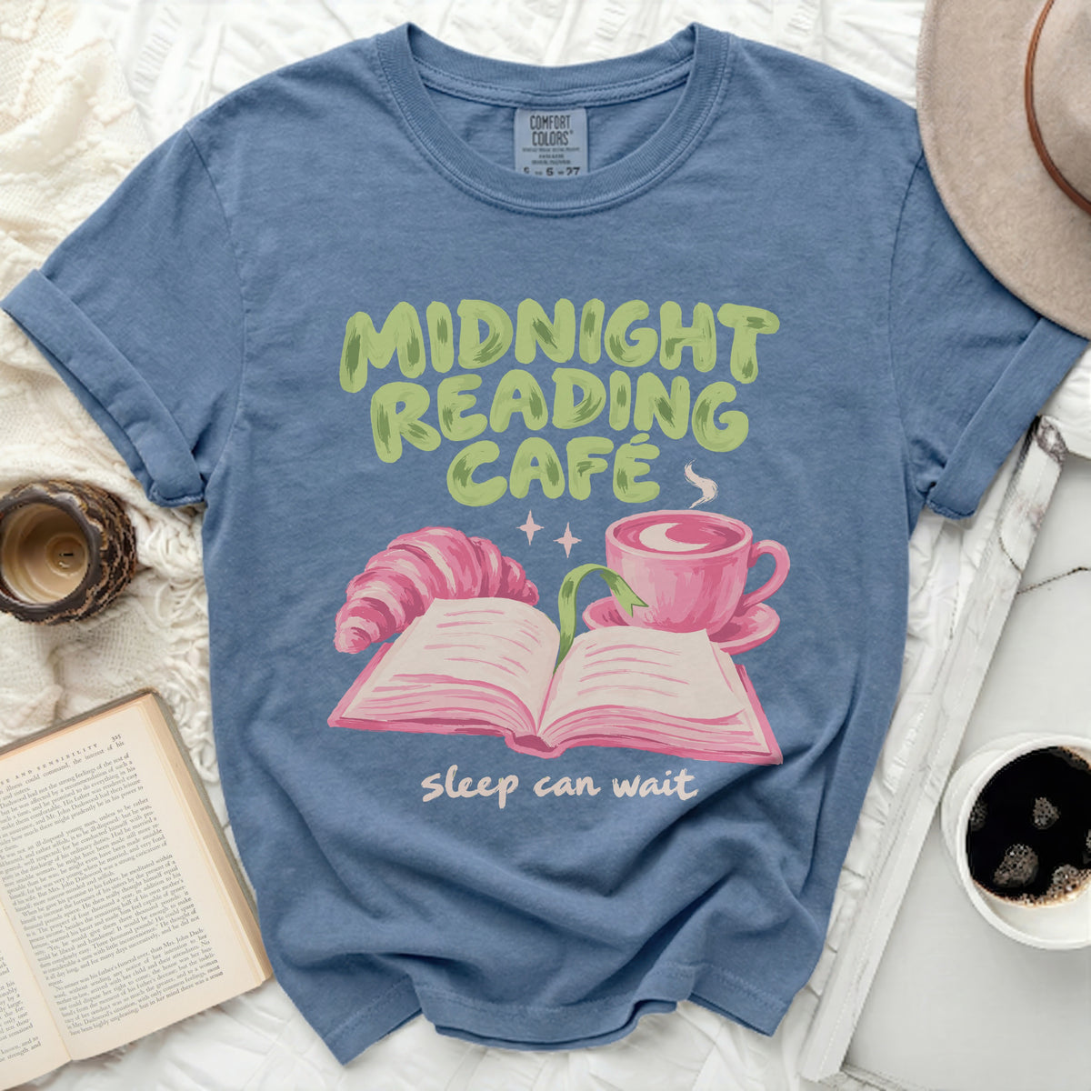 Blue t-shirt with "Midnight Reading Cafe sleep can wait" graphic.