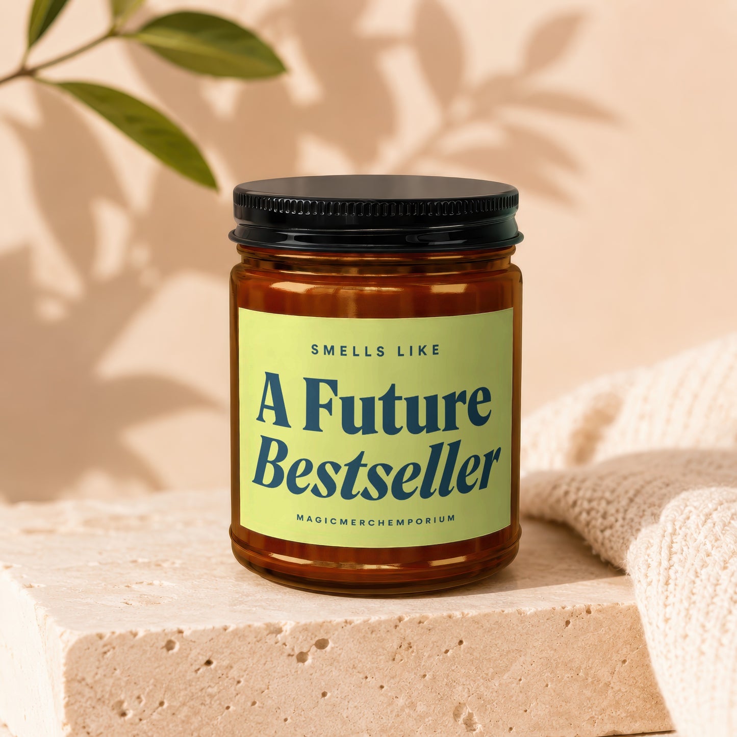 Brown glass candle with a lime green label that reads "SMELLS LIKE A Future Bestseller"