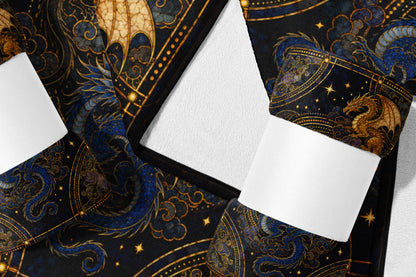 Dark fabric with swirling blue dragons, golden dragons, clouds, and stars pattern.