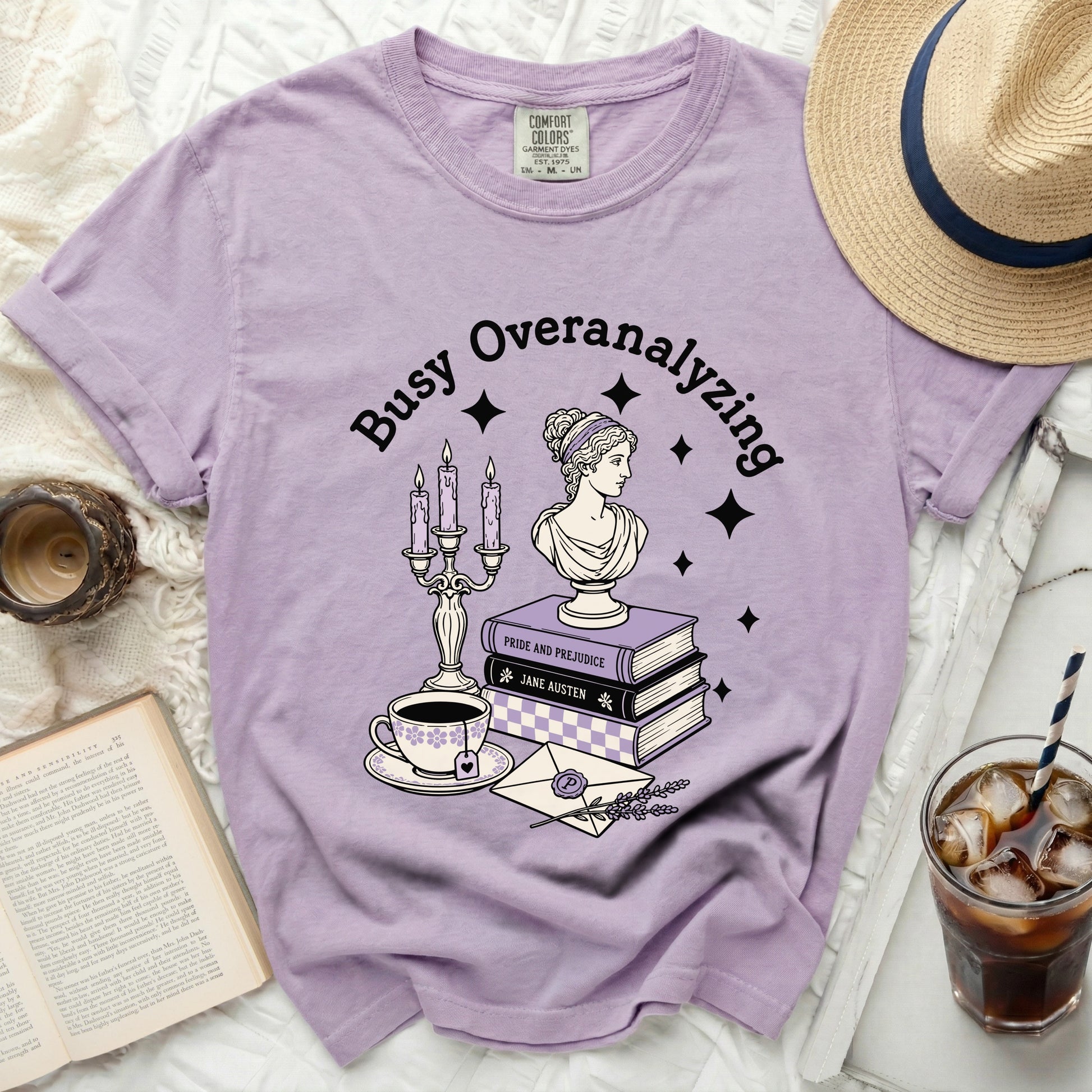 Lavender shirt with "Busy Overanalyzing" and literary art.